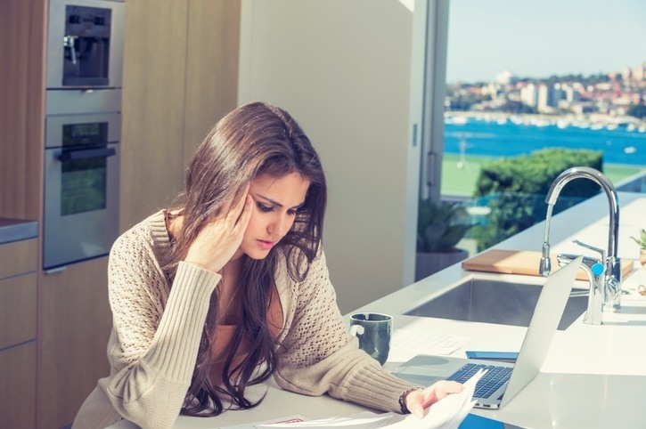 Credit Repair in CA Credit Repair Lawyers of America lady looking at credit report